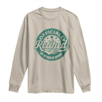 Sand long-sleeve retirement T-shirt with green “Officially Retired” front graphic