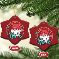 Two red heart-shaped Christmas ornaments with Santa graphic, front and back sides shown