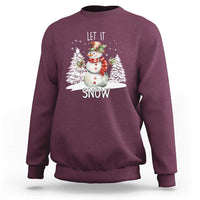 Maroon crewneck sweatshirt with snowman graphic and 'LET IT SNOW' text