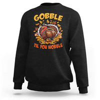 Black sweatshirt with turkey graphic and 'Gobble Til You Wobble' wording