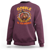Maroon sweatshirt with turkey graphic and 'Gobble Til You Wobble' wording