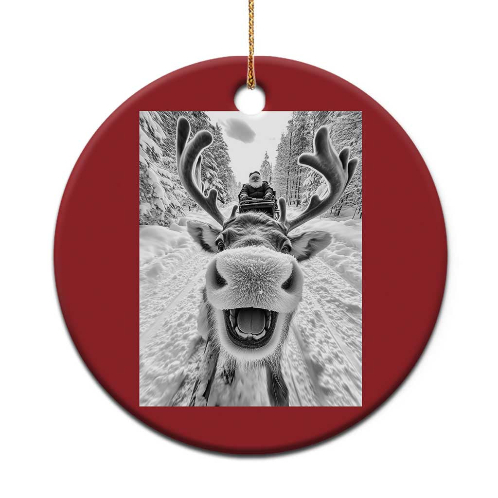 Red round Christmas ornament with selfie-style reindeer photo graphic and hanging loop