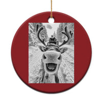 Red round Christmas ornament with selfie-style reindeer photo graphic and hanging loop