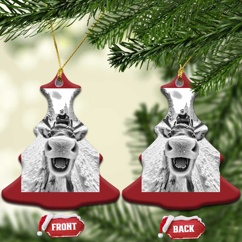 Red Christmas bell-shaped ornament with hanging loops and selfie-style reindeer graphic