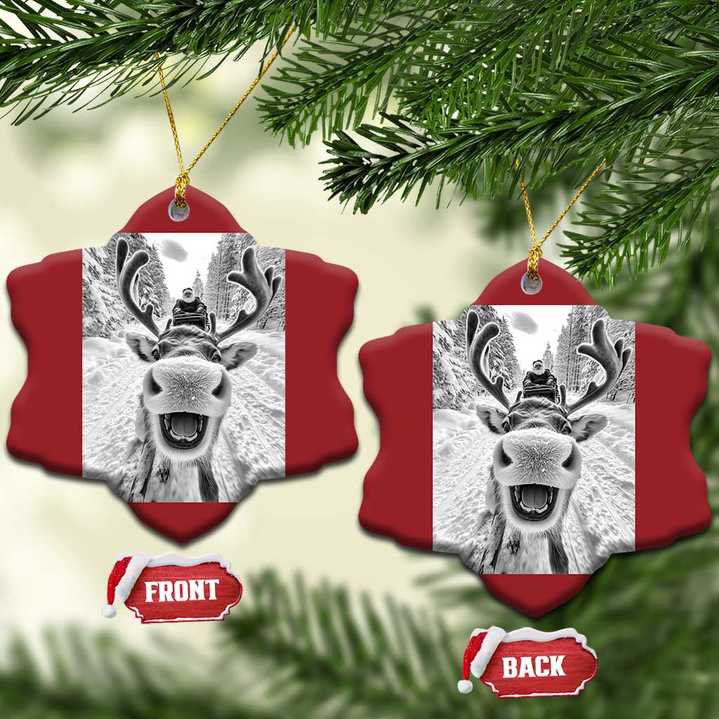 Red shirt-sleeve shaped Christmas ornament with selfie-style reindeer graphic and hanging loops