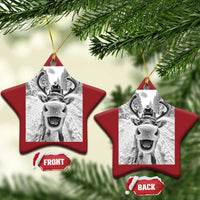 Red star-shaped Christmas ornament with hanging loop and selfie-style reindeer photo graphic
