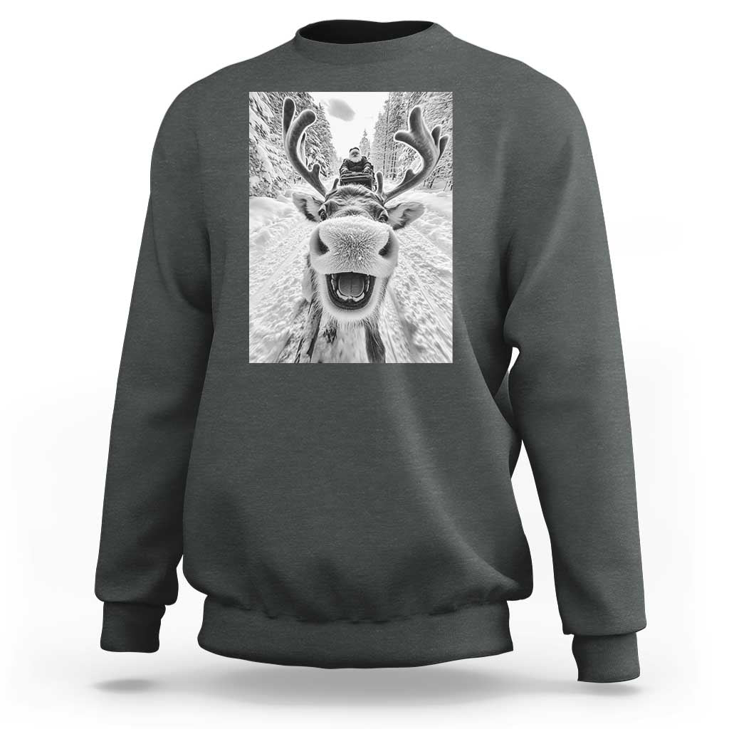 Dark heather crewneck sweatshirt with grayscale reindeer graphic on chest