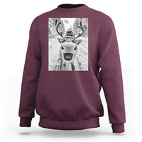 Maroon crewneck sweatshirt with grayscale reindeer graphic on chest