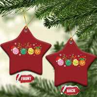 Red star-shaped pickleball Christmas ornaments with colorful ball graphic and gold hanging loops
