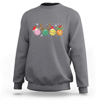 Charcoal heather crewneck sweatshirt with long sleeves and colorful pickleball Christmas graphic