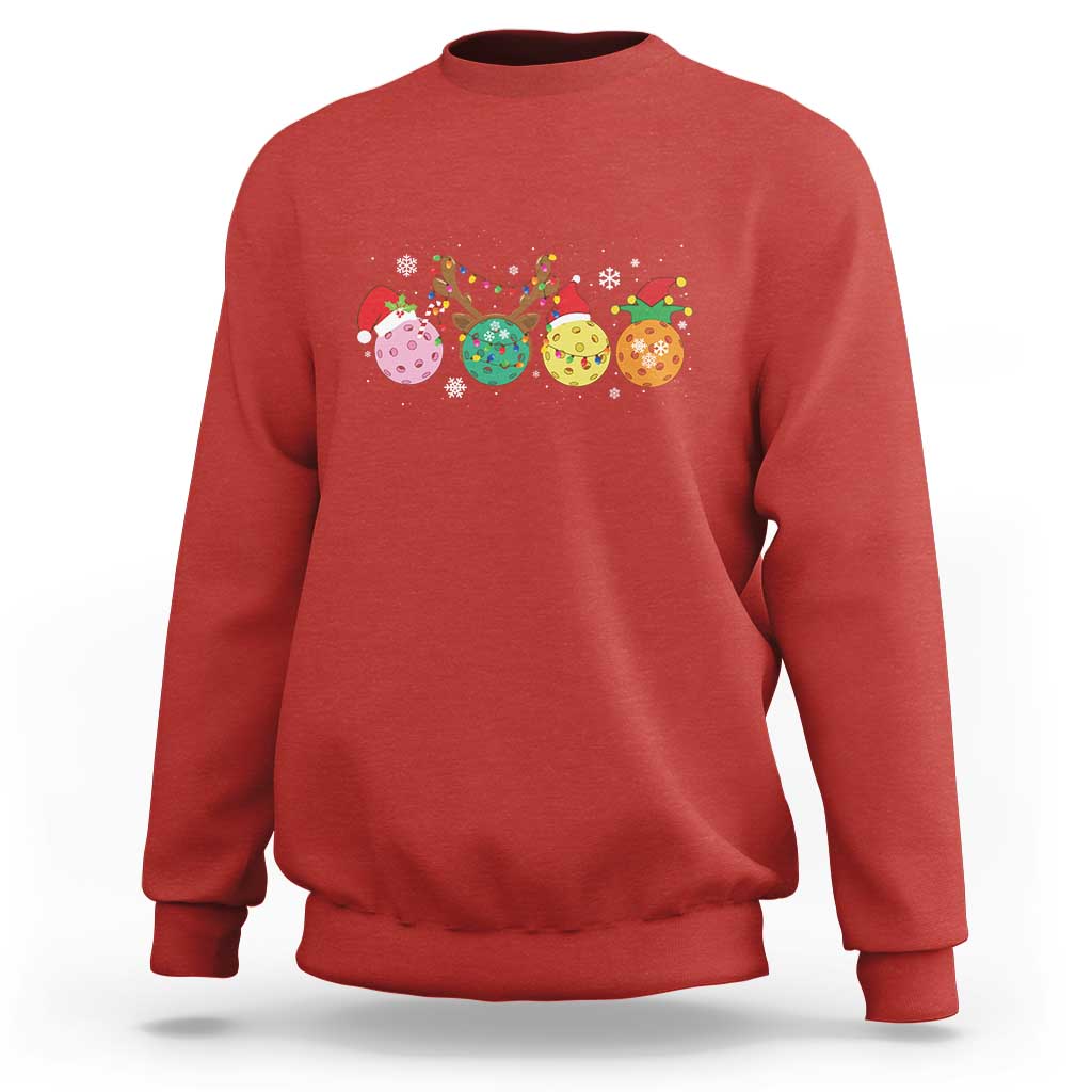 Red crewneck sweatshirt with long sleeves and colorful pickleball Christmas graphic