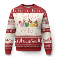 Red knit Christmas sweater with festive tree border and colorful ornament graphic