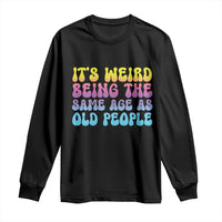 Black long-sleeve shirt with colorful “It’s Weird Being the Same Age as Old People” graphic