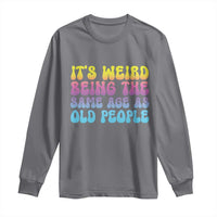 Charcoal long-sleeve shirt with colorful “It’s Weird Being the Same Age as Old People” graphic