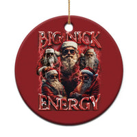 Red round Christmas ornament with Big Nick Energy graphic and bearded Santa characters