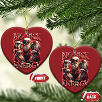 Two red heart-shaped hanging ornaments with Big Nick Energy text and Santa lineup