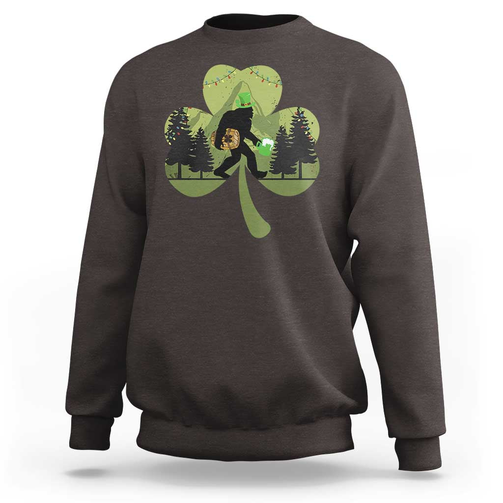 Dark chocolate sweatshirt with Bigfoot graphic holding a green shamrock and clover leaves