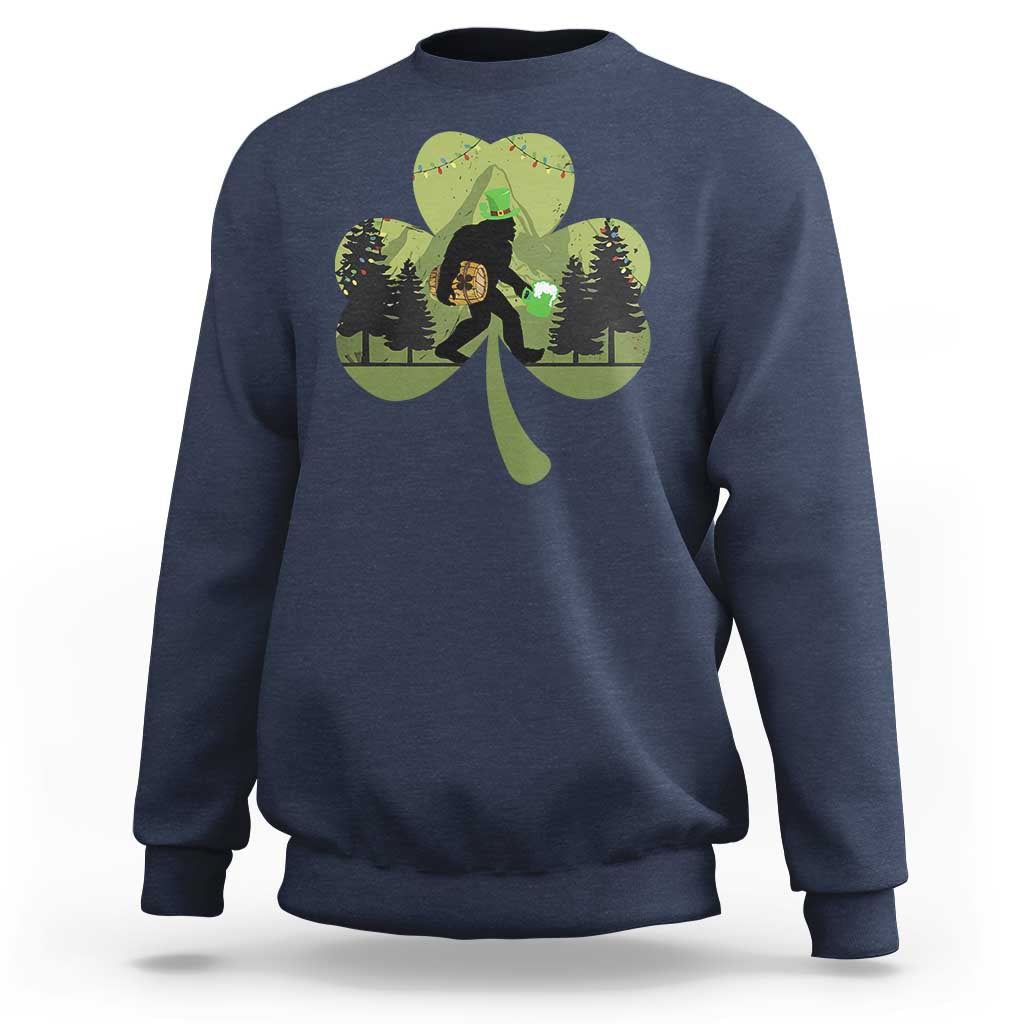 Navy sweatshirt with Bigfoot graphic holding a green shamrock and clover leaves