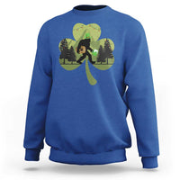 Royal blue sweatshirt with Bigfoot graphic holding a green shamrock and clover leaves