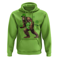 Lime green pullover hoodie with Bigfoot holding shamrocks graphic on front