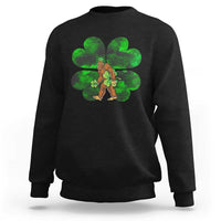 Black crewneck sweatshirt with green shamrock Bigfoot graphic on front