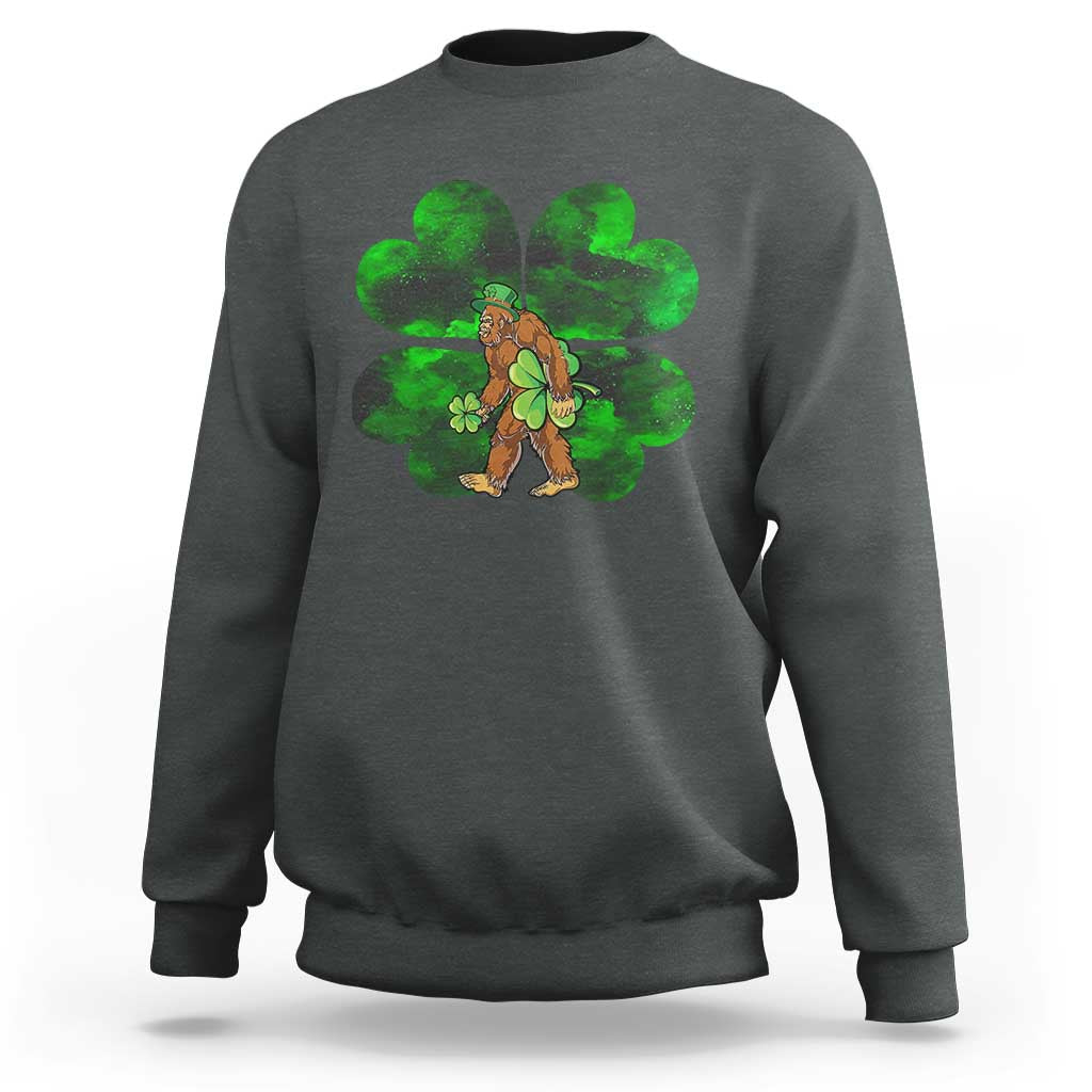 Dark gray crewneck sweatshirt with green shamrock Bigfoot graphic on front