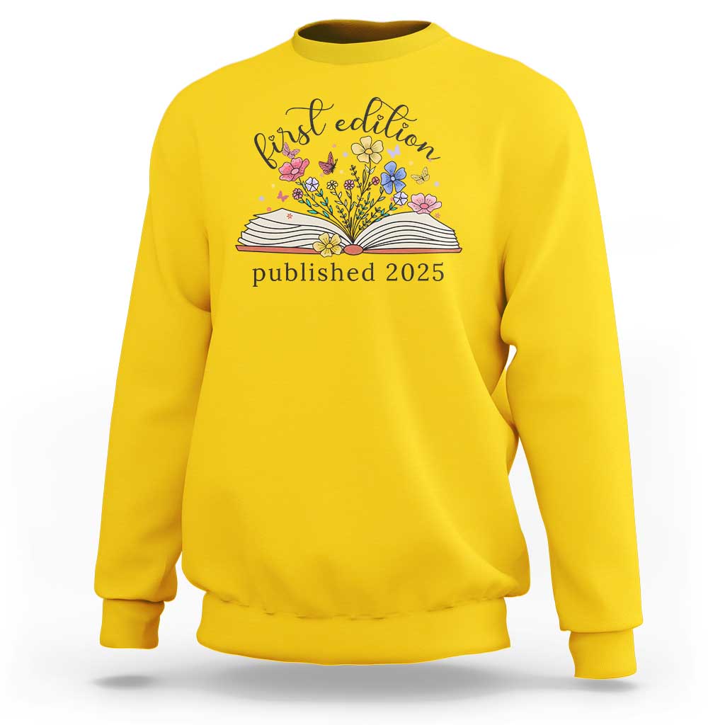 Daisy yellow crewneck sweatshirt with floral book stack and “published 2025” front print.