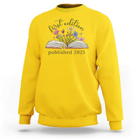 Daisy yellow crewneck sweatshirt with floral book stack and “published 2025” front print.