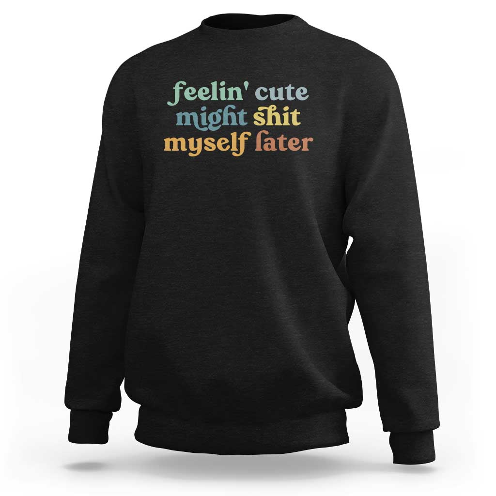 Black sweatshirt with front graphic text in green and orange