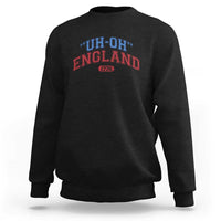 Black crewneck sweatshirt with “UH-OH” “ENGLAND” and “1776” graphic on chest
