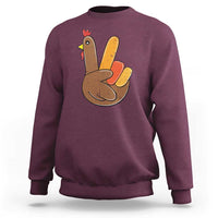 Maroon Thanksgiving sweatshirt with peace-sign turkey graphic on chest