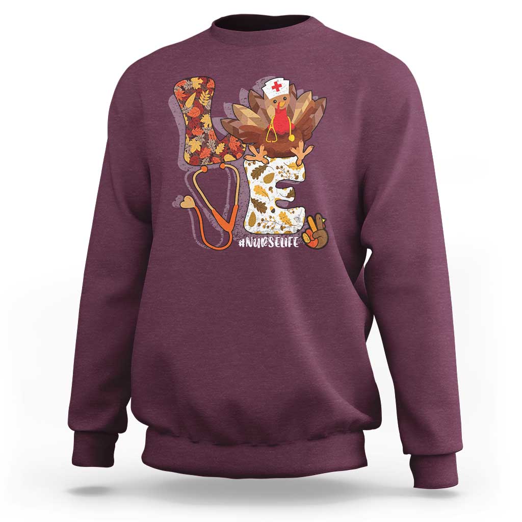 Maroon sweatshirt with nurse-turkey autumn graphic on back