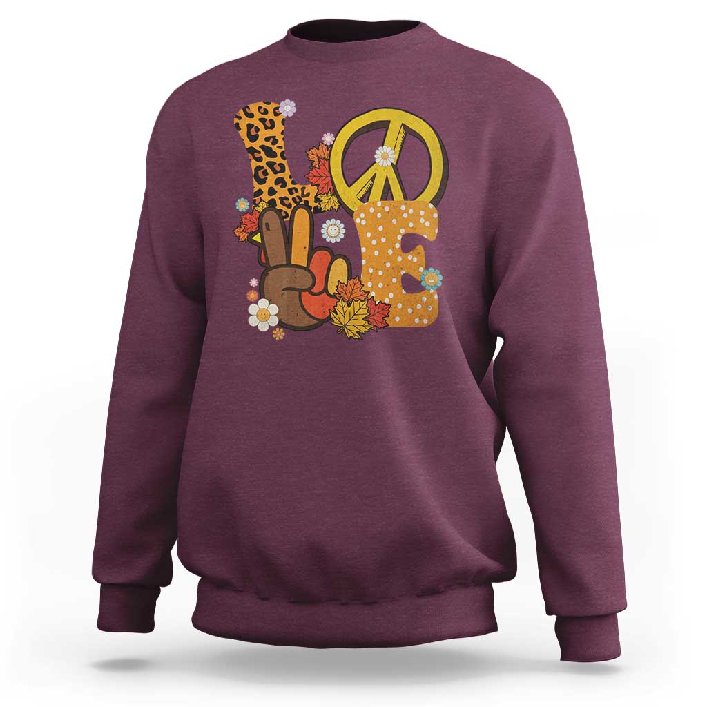 Maroon Thanksgiving sweatshirt with peace sign and turkey graphic, crew neck.