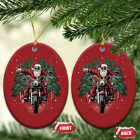 Two red oval motorcycle Santa Christmas ornaments with gold hanging loops