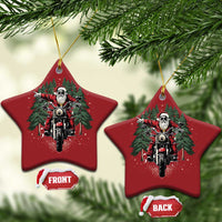 Two red star-shaped motorcycle Santa Christmas ornaments hanging from gold loops