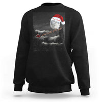 Black crewneck sweatshirt with moon-and-Santa graphic centered on the back