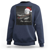 Navy crewneck sweatshirt with moon-and-Santa graphic across the chest
