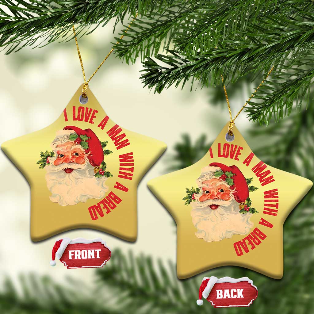 Two gold star-shaped Santa Christmas ornaments with red love message; front and back shown