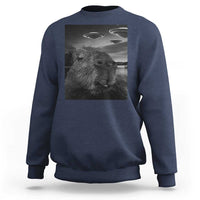 Navy crewneck sweatshirt with capybara selfie graphic and UFOs print