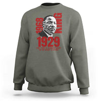 Heather green sweatshirt with large front portrait graphic and red 1929 text, crew neck long sleeves