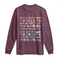 Maroon long-sleeve shirt with multicolor floral 'THINK DIFFERENTLY' front graphic.
