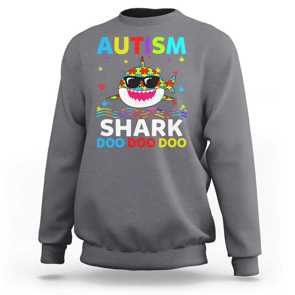 Charcoal gray crewneck sweatshirt with colorful AUTISM SHARK graphic on front