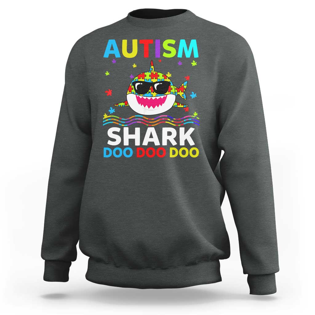 Dark heather crewneck sweatshirt with colorful AUTISM SHARK graphic on front