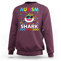Maroon crewneck sweatshirt with colorful AUTISM SHARK graphic on front