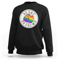 Black crewneck sweatshirt with circular pride chameleon graphic on chest
