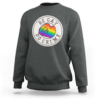 Charcoal crewneck sweatshirt with circular pride chameleon graphic on chest