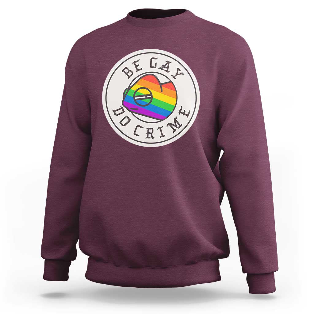 Maroon crewneck sweatshirt with circular pride chameleon graphic on chest