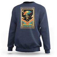 Navy crewneck sweatshirt with front graphic of rainbow umbrella skeleton in gold frame