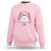 Light pink crewneck sweatshirt with pink bat-winged ghost graphic and heart text
