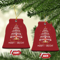 Two red bell-shaped radiology ornaments with dancing skeleton tree and “MERRY + BRIGHT”